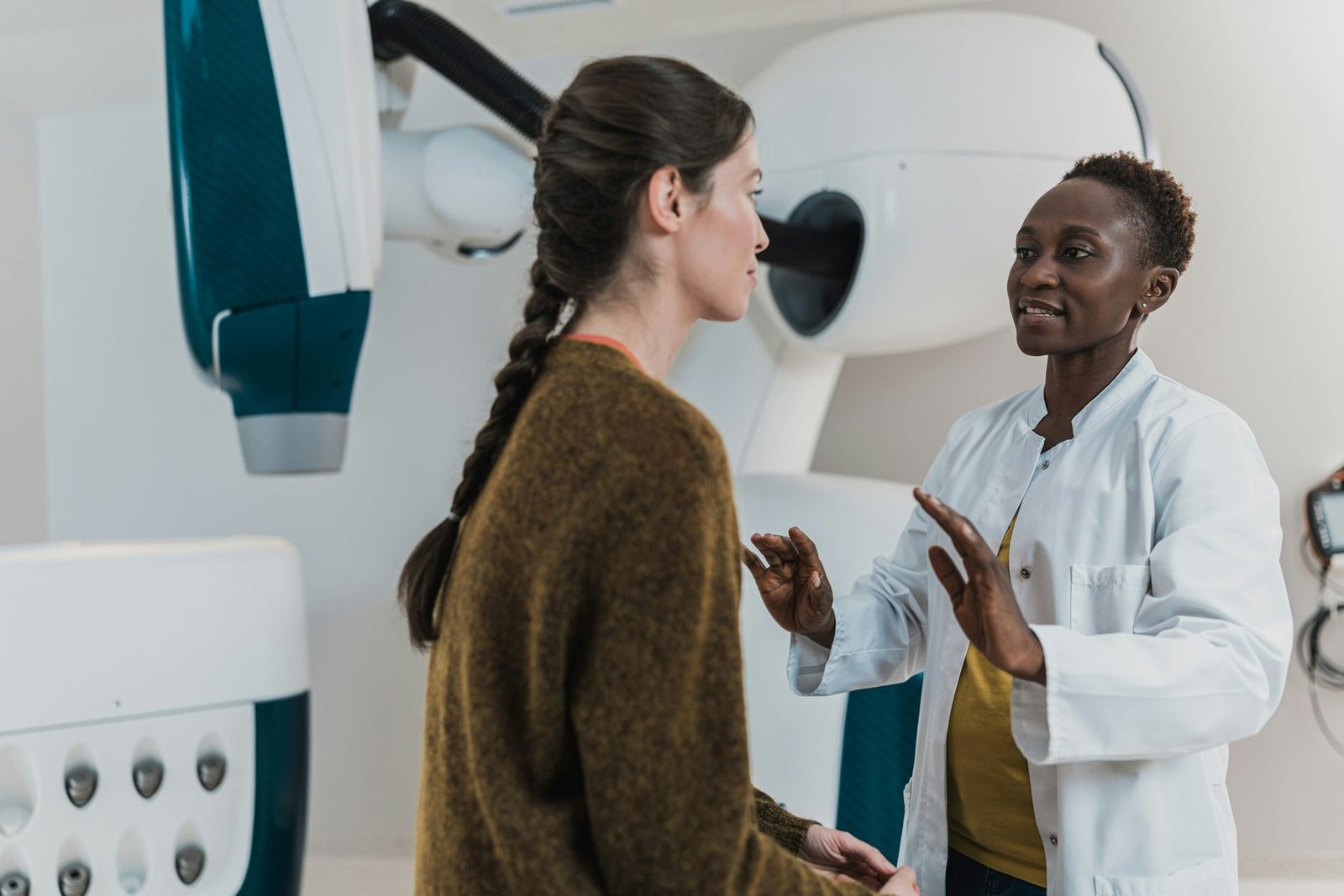 A clinician talking a patient through an imaging procedure