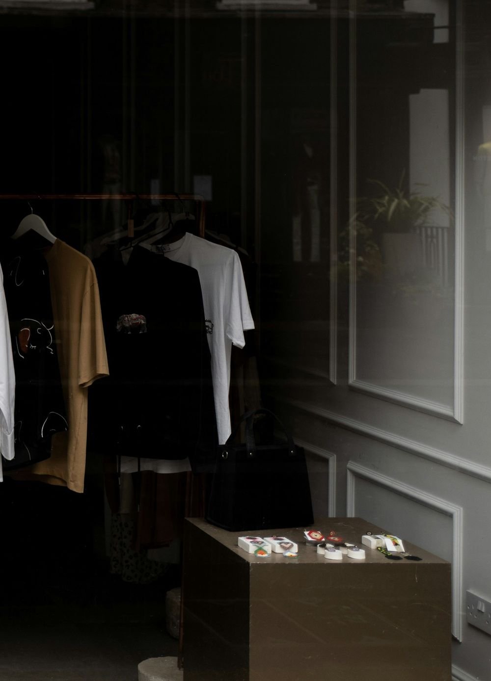 Clothing on a rail in a boutique window