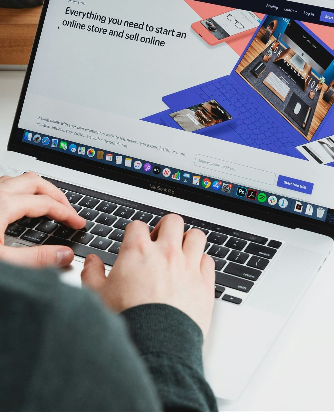 A person building an online store on a laptop